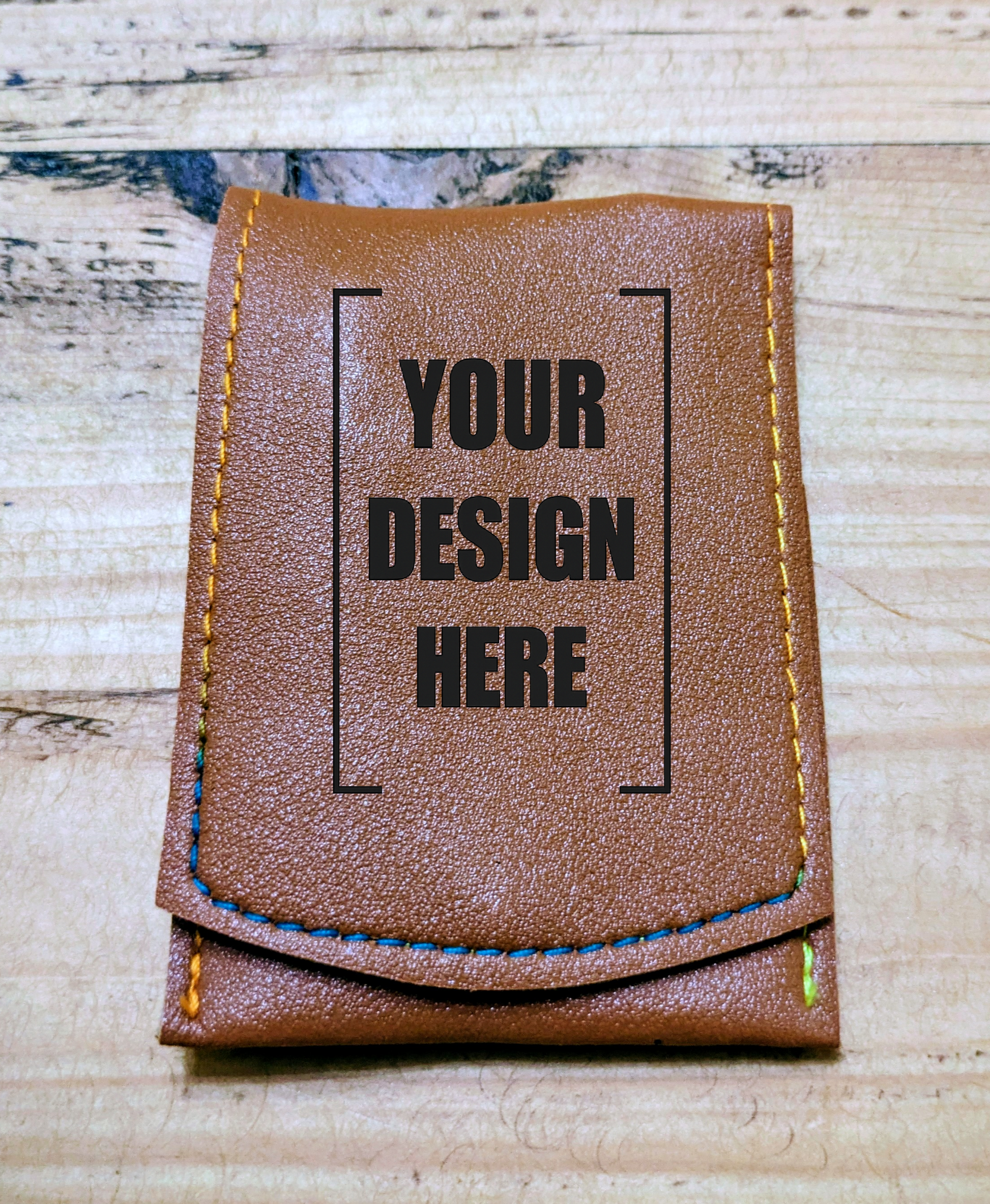 Customisable brown leather grooming kit pouch with placeholder text 'Your Design Here' for personalised engraving options.